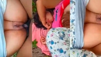 A man fucks his girlfriend outside of bushes.
